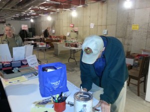 A patron takes time to fill out the Library questionnaire